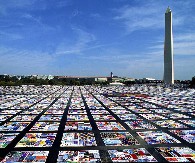 A gigantic tapestry of AIDS quilts in Washington D.C. The NAMES Project Foundation. Photo: M. Thiessen.
